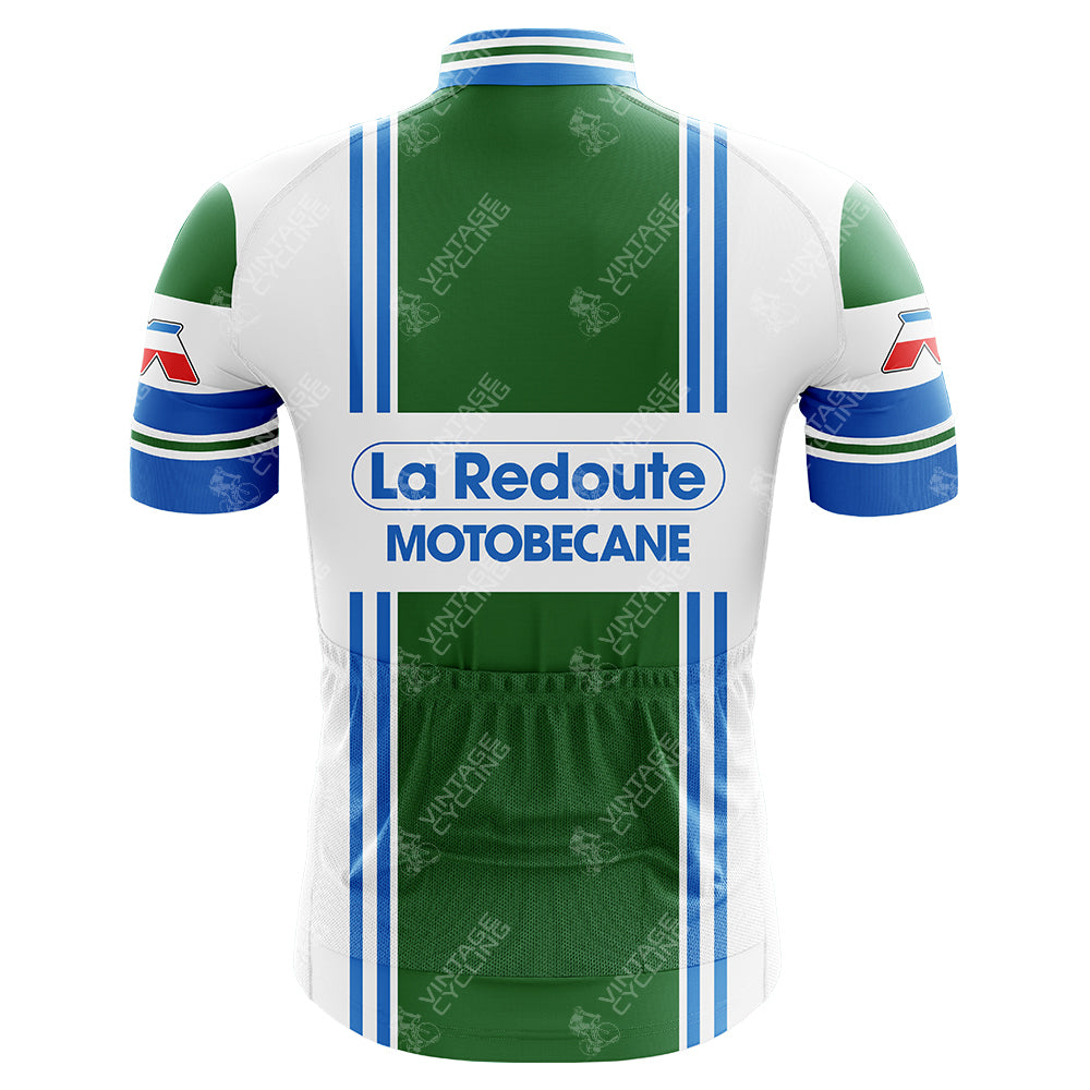 The La Redoute Motobecane Retro Cycling Jersey features a green, blue, and white palette with a back view. It showcases the La Redoute MOTOBECANE logo, sponsors on sleeves and sides, and vertical stripes on the back for vintage charm.