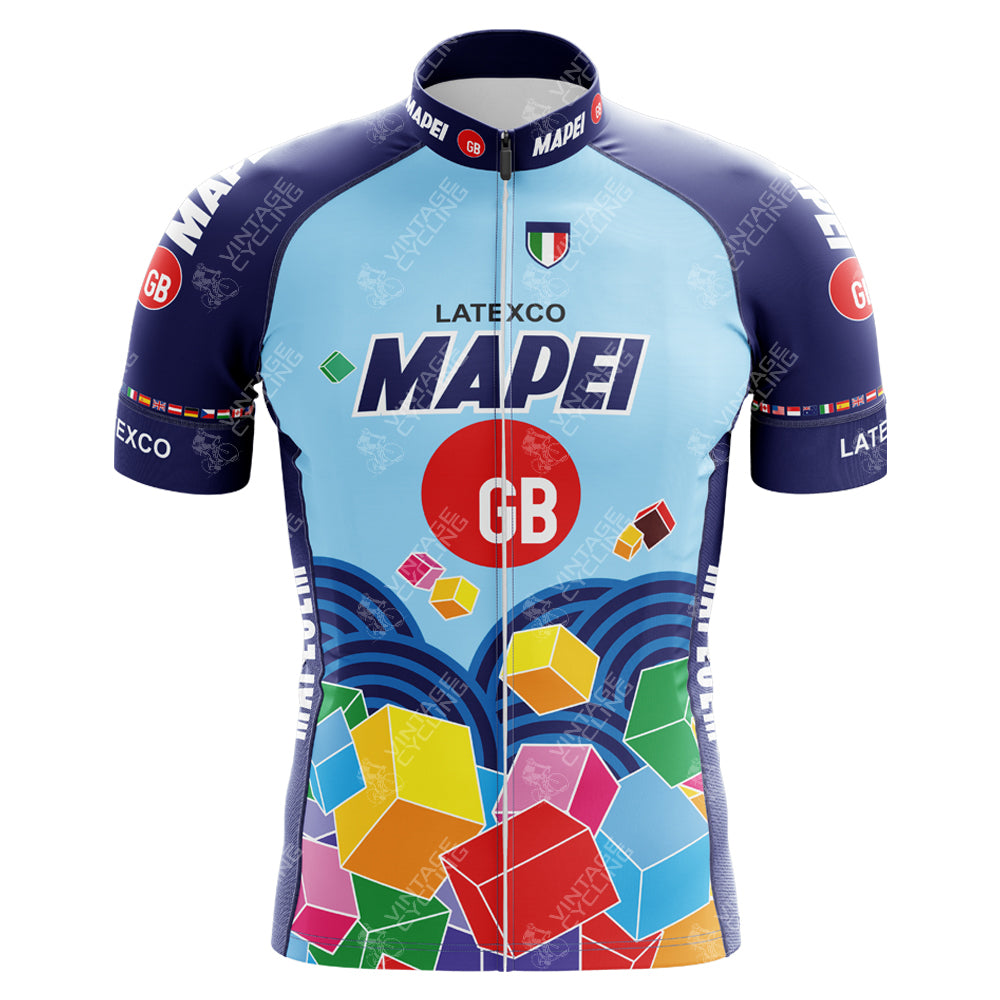 The Mapei GB Colnago Retro Cycling Jersey features a vibrant geometric design with LATEXCO and GB logos, primarily in blue with multicolored cubes. It evokes classic Cycling Team Jerseys and includes a subtle Italian flag on the collar, capturing Colnagos spirit.