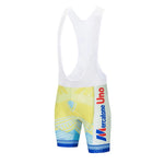 Credit Agricole Retro Short Sleeve Cycling Set features bib shorts with vibrant yellow and light blue design, white shoulder straps, and a right-side Mercatone Uno logo in red and blue, all set against a plain white background with a geometric pattern.
