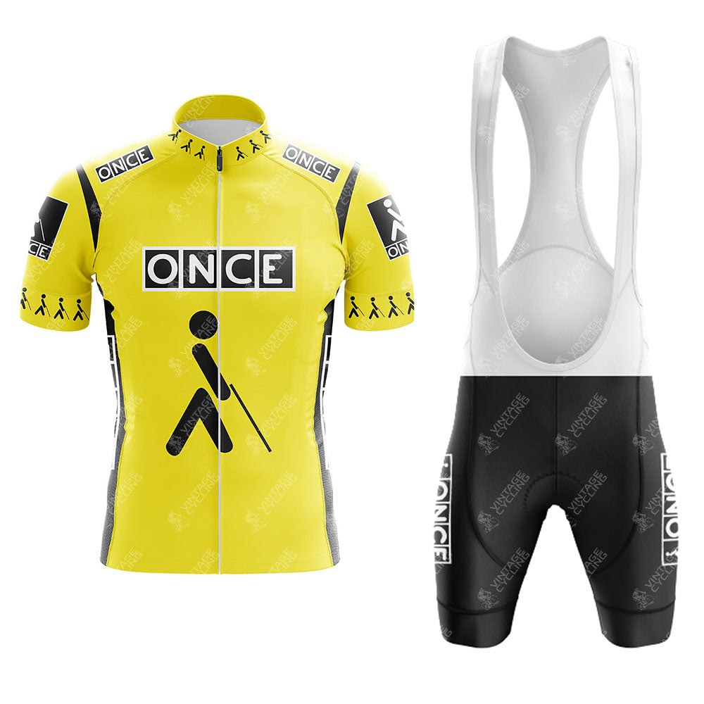 The Reynolds Yellow Retro Short Sleeve Cycling Set features a yellow and black jersey with ONCE and cane logos, paired with black bib shorts with white straps and matching logos for a classic, standout cycling look.
