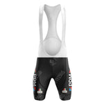 The White Reynolds Retro Short Sleeve Cycling Set features black shorts with white straps, adorned with the PDM ULTIMA logo in white and red. A subtle white pattern enhances the timeless retro aesthetic.