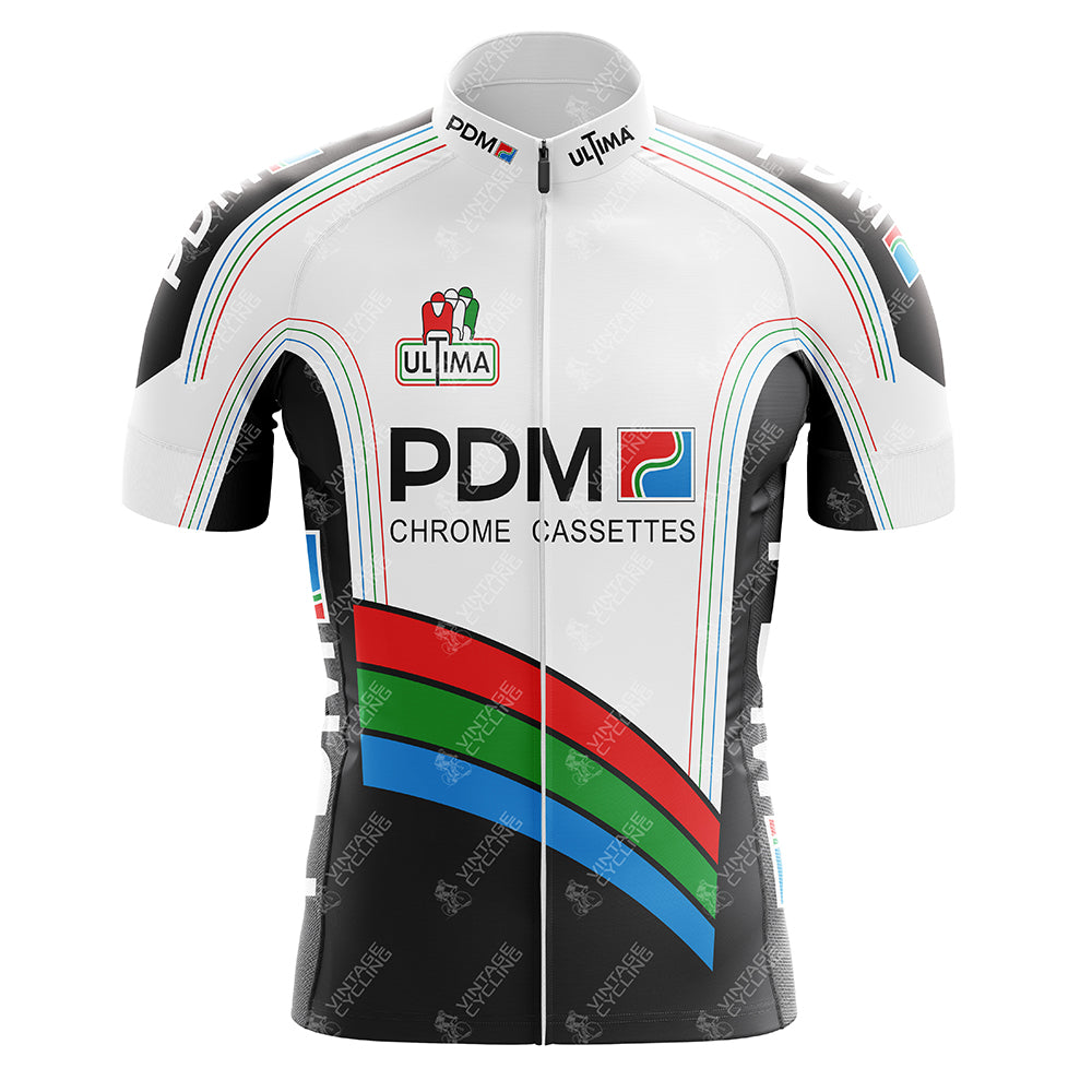 The Équipe Cycliste PDM (Chrome Cassettes) Retro Cycling Jersey is white with bold black, green, red, and blue stripes. It features PDM and Chrome Cassettes logos on the front, with Ultima and Peter Post on the chest plus sponsor logos on shoulders and sides.