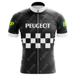 Meet the Peugeot BP Retro Cycling Jersey, made from quick-drying polyester. It showcases a black and white checkered design with Peugeot on the chest and green patches with yellow BP logos on the sleeves. A silicone waist strip ensures a perfect fit during your ride.