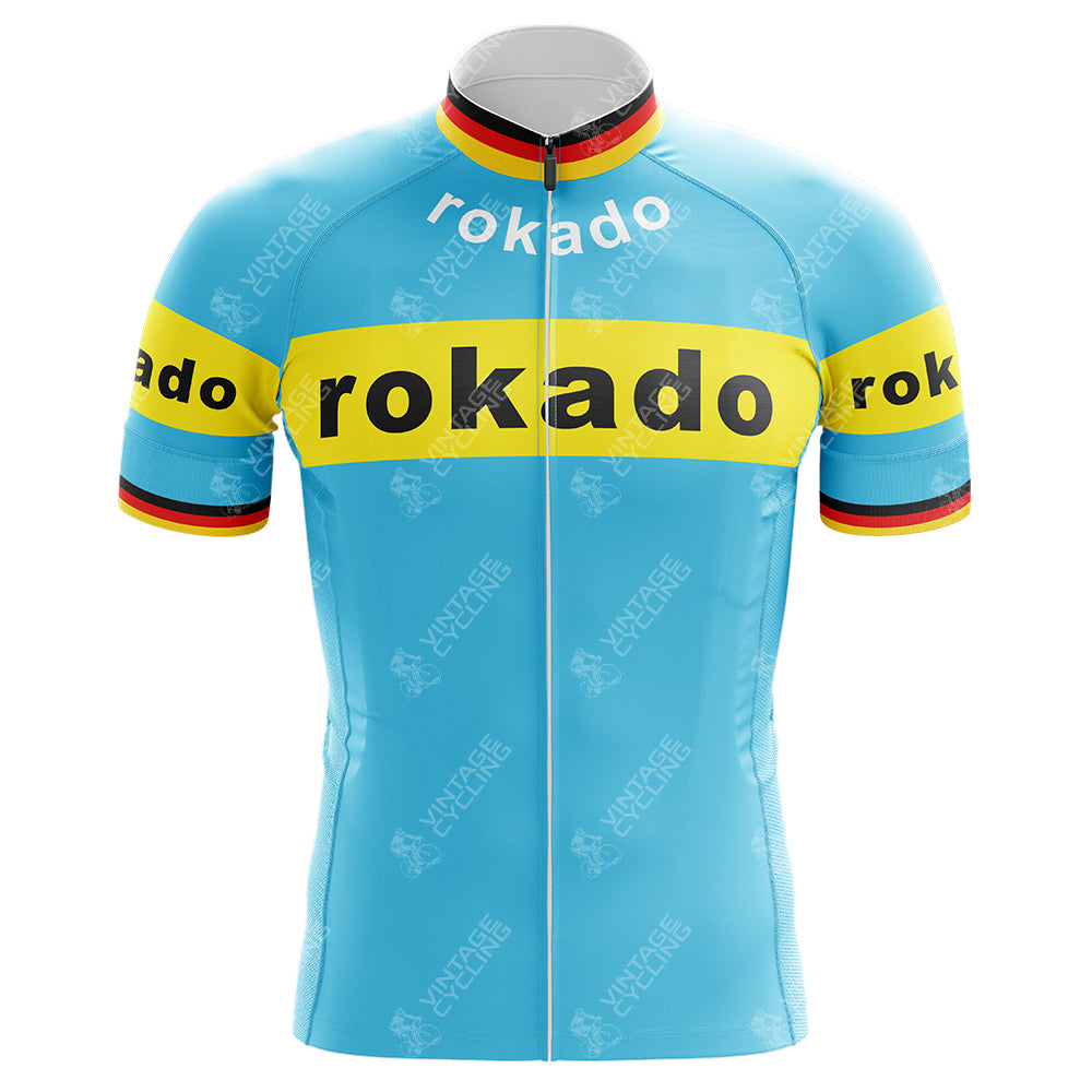 The Rokado Retro Cycling Jersey showcases rokado in bold black on vibrant yellow stripes across the chest and sleeves. Made from lightweight polyester, it features a sleek, performance design accented with black, red, and yellow trim for an eye-catching finish.