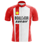 The Freddy Maertens 1981 Boule d’Or Sunair Retro Cycling Jersey is a red and white piece with a front zipper, lightweight polyester fabric, yellow shoulder logo, and BOULE DOR and sunair in bold black text across the chest, evoking Maertens iconic style.