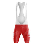 The Mercatone Uno Retro Short Sleeve Cycling Set features vintage-inspired red and white bib shorts with a white strap, red lower section, logos, and text. Designed for cycling comfort, it includes padding and showcases classic design elements.