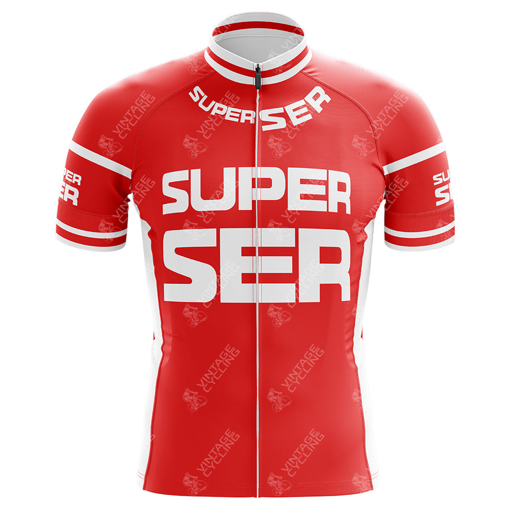 The Super Ser Retro Cycling Jersey is a red polyester jersey featuring bold white SUPER SER text on the front and sleeves. It has a full-length zipper, small white accents on the shoulders and sides, a classic cut, and a high collar reminiscent of retro cycling jerseys.