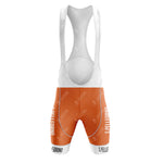 Orange and white cycling bib shorts branded with S. Pellegrino, featuring the brand name vertically on each leg and white straps with a subtle pattern. Part of the S.PELLEGRINO Retro Short Sleeve Cycling Set, they offer style and comfort on every ride.