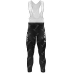 The T-Mobile Retro Long Sleeve Cycling Set, featuring black and white bib tights with repeated T-Mobile logos in white on the legs, is made from lightweight polyester. The set includes a white bib with shoulder straps, depicted on a plain white background.