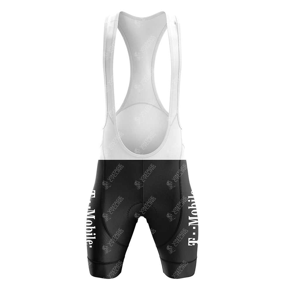 The T-Mobile Retro Short Sleeve Cycling Set features black and white bib shorts with T-Mobile branding, form-fitting for an aerodynamic shape. The vintage style includes a white mesh upper and black lower section with logos on the thighs, perfect for a retro cycling aesthetic.