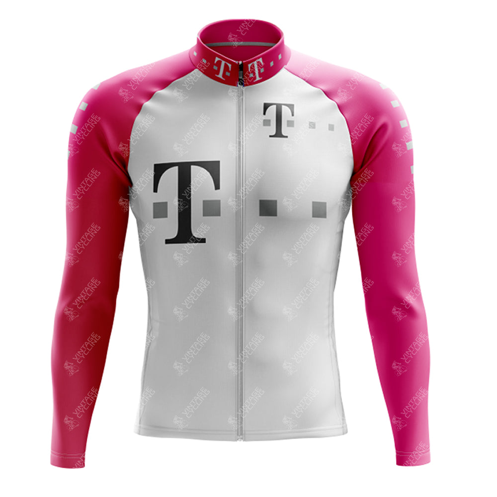 The T Retro Long Sleeve Cycling Set is made from lightweight polyester with a pink and white color scheme. It features large T logos and small geometric shapes on the front, pink sleeves and shoulders, a white body, and a front zipper. A fleece option is available.