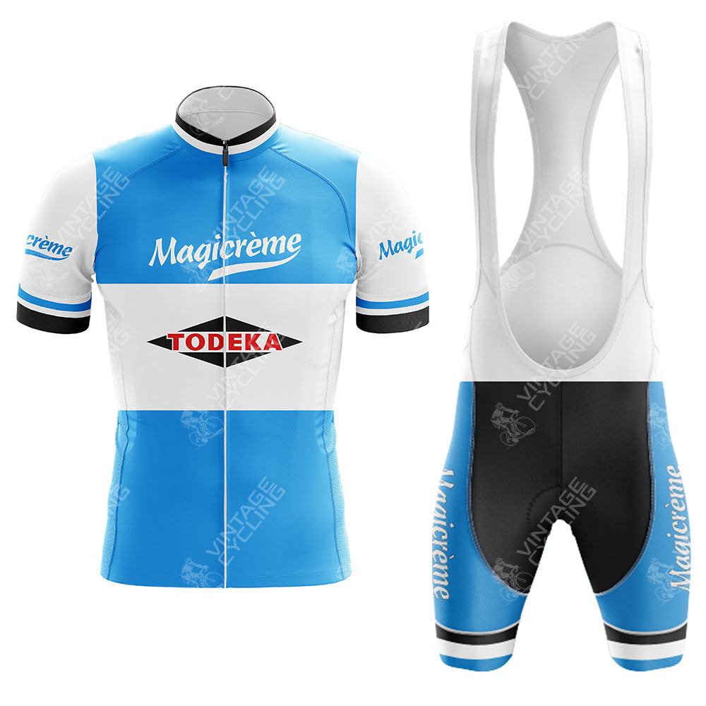 The Margnat Paloma Retro Short Sleeve Cycling Set features a blue, white, and black jersey with front zipper and Todeka Magicreme logos, plus bib shorts with white shoulder straps for comfort and style.