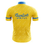 The Bartali Ursus Retro Cycling Jersey features a vibrant yellow design with blue cuffs and collar. It showcases a blue logo and Bartali URSUS text on the back, honoring Gino Bartali. Stitch detailing adds charm, and a bottom pocket offers practicality.
