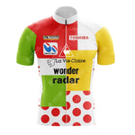 The Bobet Hutchinson BP Retro Short Sleeve Cycling Set features a patchwork of green, red, yellow, and white with red polka dots. With logos like Toshiba and La Vie Claire, it embodies the classic Tour de France design—a nod to the vintage cycling aesthetic.