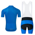 Displayed is the Bike Logo Blue Cycling Jersey Set, including a breathable short-sleeve blue jersey with white trim and back pockets, paired with blue and black bib shorts featuring white straps and padded seat areas for ultimate comfort.