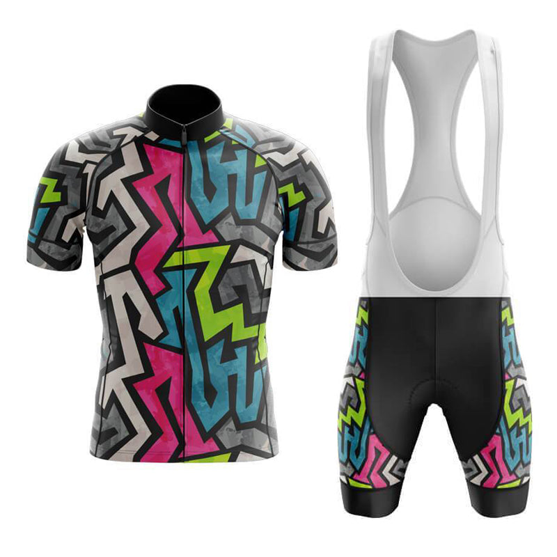 The Jazzy Retro Cycling Jersey Set includes a short-sleeve jersey and bib shorts with a bold geometric pattern. Made from lightweight polyester for breathability, it features colorful zigzags in pink, blue, green, and gray on a black background.