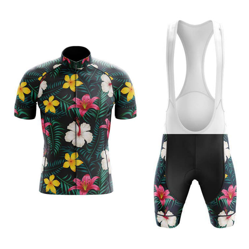 Enhance your cycling experience with the Floral Big Yellow Pink Cycling Jersey Set, featuring a retro vibe and tropical floral design. The short-sleeved jersey boasts a black backdrop with pink, yellow, and white flowers accented by green leaves, paired with matching bib shorts displaying similar side patterns.