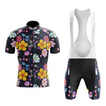 The Floral Big Yellow Cycling Jersey Set includes a retro floral jersey with a black short-sleeve design, front zipper, and vibrant yellow, pink, blue, and purple patterns. Matching bib shorts feature white suspenders for a sleek look.