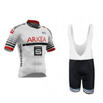 The Arkea-Samsic Retro Cycling Jersey Set includes a white short-sleeved jersey with red and black accents, logos, and sponsor names reminiscent of UCI ProTeam Arkea-Samsic. The black bib shorts have white straps and matching leg stripes.