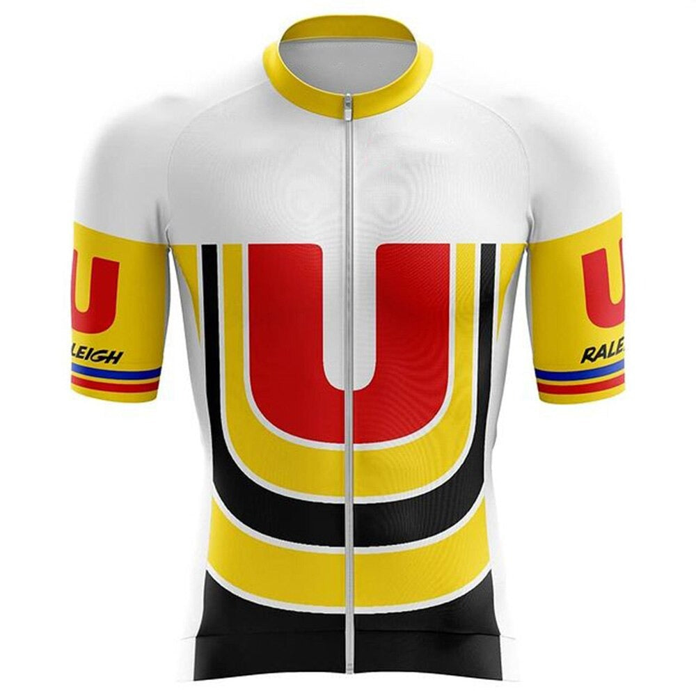 The Raleigh U Retro Cycling Jersey displays large red and black U curves on a white background. Its made of lightweight polyester with yellow sleeves featuring Raleigh and red-blue stripes, along with a front zipper for enhanced performance.