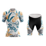 Introducing the Womens Floral White Blue Cycling Jersey Set, crafted from lightweight polyester with a stunning floral design of blue, yellow, and black leaf patterns on a white background. The black shorts have matching side patterns and a gel seat pad for ultimate comfort.