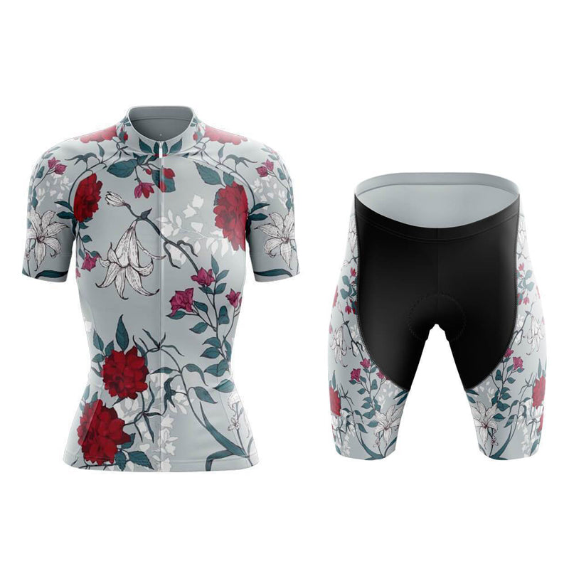 The Womens Floral Big Red Cycling Jersey Set includes a lightweight polyester jersey and black shorts with a matching floral pattern. The set also features a breathable gel seat pad for added comfort.