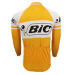 The BIC Yellow Long Sleeve Retro Cycling Jersey, available in a fleece option, features a white and orange design with the Bic logo and figure on the back and sleeves. Made from lightweight polyester, it includes pockets on the lower back for a sporty look.