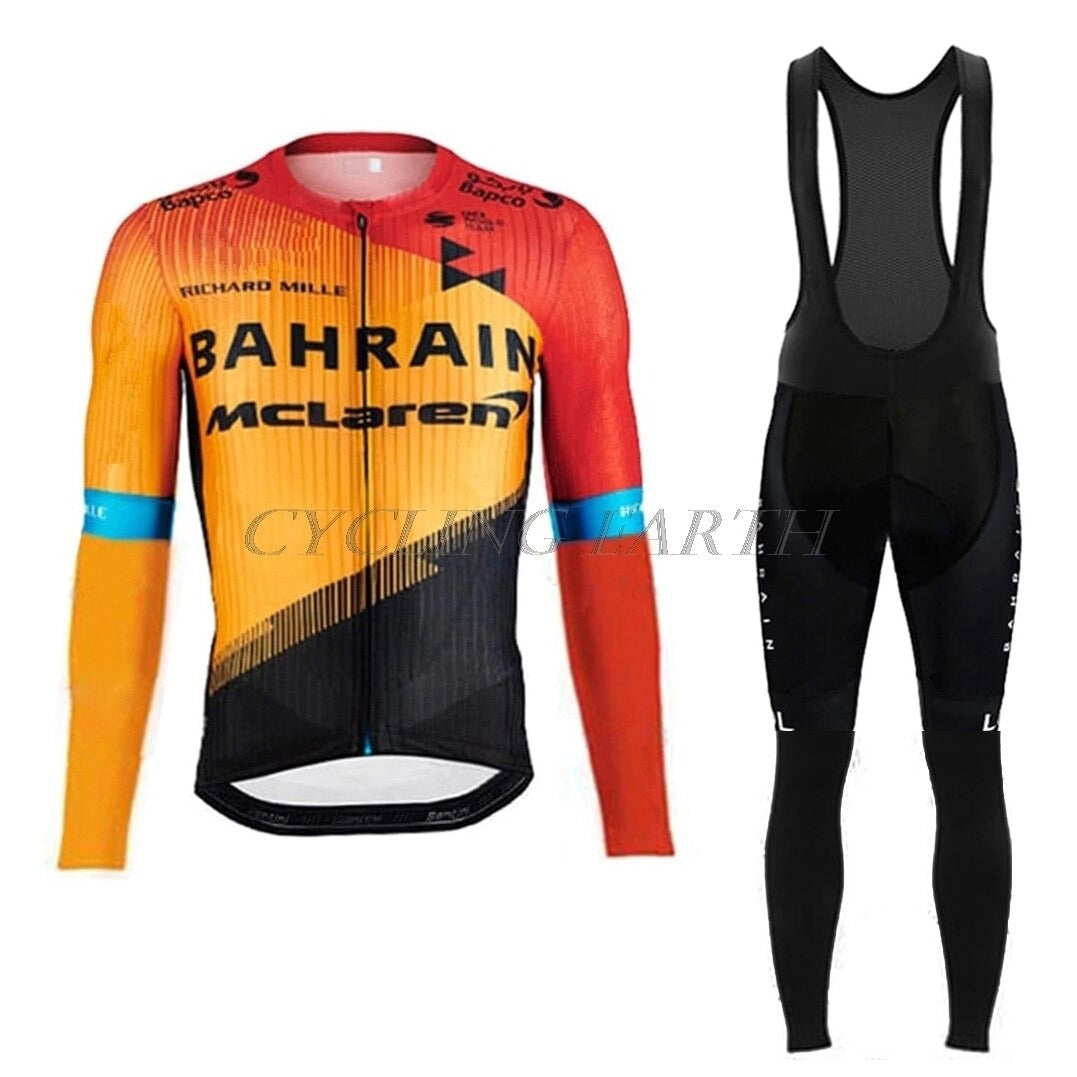 The Bahrain McLaren Le Col Cycling Team Long Set features a colorful long-sleeve jersey in red, orange, and yellow with BAHRAIN McLAREN text and black bib tights with a mesh upper. Perfect for those wanting the full team look.