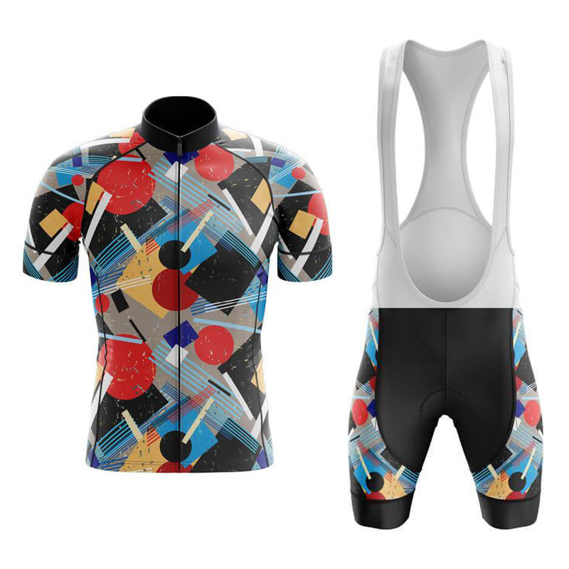 The Bauhaus Retro Cycling Jersey Set features a vibrant geometric pattern with abstract red, blue, yellow, and black shapes. It includes a short-sleeve jersey and black-padded bib shorts with white straps for breathable comfort on all your cycling adventures.