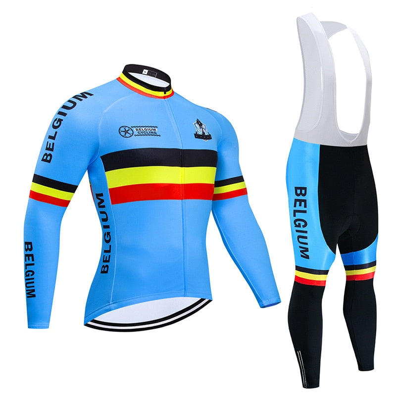 The Belgium Cycling Team Retro Cycling Jersey Long Set features a fleece option, light blue long-sleeve jersey with Belgium, black bib tights, and striking black, yellow, and red stripes. The jersey includes a chest logo and zip closure.