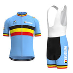 The Belgium Cycling Team Retro Cycling Jersey Set features a blue jersey with black, yellow, and red stripes and BELGIUM on both the jersey and bib shorts. The bib shorts have a white upper with matching blue and striped accents.