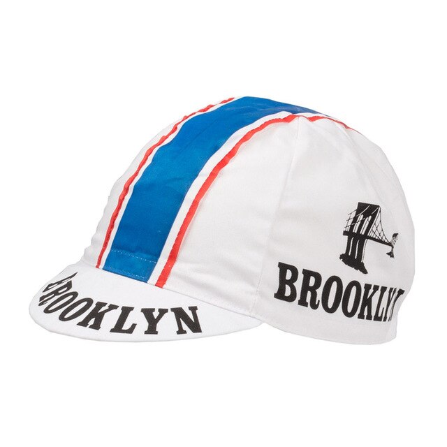 Brooklyn Retro Cycling Caps are white with a blue stripe bordered by red and adorned with BROOKLYN and a bridge illustration on the side. The brim also features BROOKLYN, inspired by classic retro design evoking the Brooklyn Chewing Gum era.