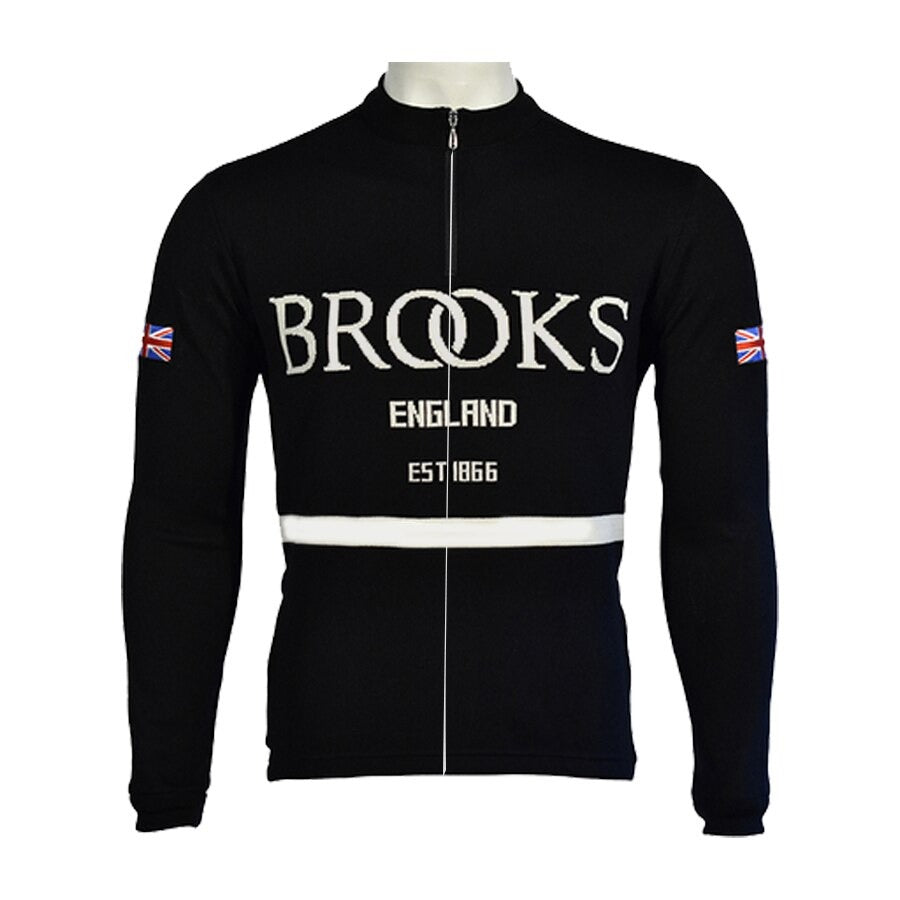 The Brooks England Long Sleeve Retro Cycling Jersey, available with a fleece option, features BROOKS ENGLAND in white on the front, classic white horizontal stripes, and Union Jack flags on the sleeves for timeless appeal.