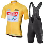 The Carrera Jeans 1987 Tour de France Retro Cycling Jersey Set features a yellow short-sleeve jersey with CARRERA, CREDIT LYONNAIS, and VAGABOND logos, capturing the classic cycling era, paired with black bib shorts showcasing Carrera Jeans branding.