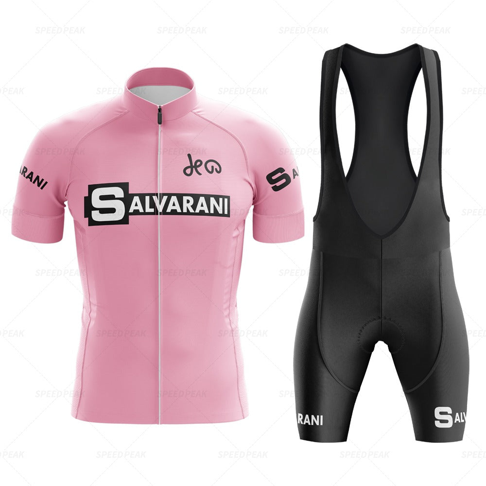 The Salvarani 1972 Retro Cycling Jersey Set, featuring a pink jersey with bold white Salvarani lettering and black bib shorts, embodies Grand Tour spirit. Sponsor logos on the sleeves and legs capture Felice Gimondis legendary style.