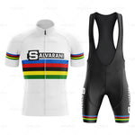 Relive cycling history with the Salvarani 1972 Retro Cycling Jersey Set featuring a white short-sleeve jersey with Salvarani and multicolor stripes, plus black bib shorts adorned in a matching classic Felice Gimondi pattern.