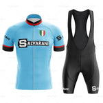 The Salvarani 1972 Retro Cycling Jersey Set, featuring a blue jersey with SALVARANI and the Italian flag on the chest, is ideal for Grand Tours. Inspired by Felice Gimondi, it includes red, white, black accents and black bib shorts with SALVARANI on the side.