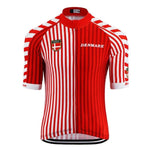 The Denmark Cycling Jersey is a lightweight polyester, short-sleeve design with red and white vertical stripes. It features DENMARK and a shield emblem on the chest, a small logo on the sleeves, and a reflective zipped back pocket for enhanced functionality and safety.