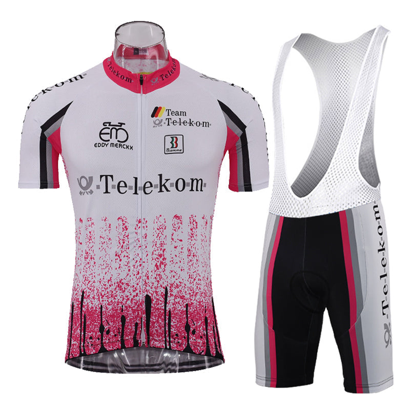 The Deutsche Telekom Retro Cycling Jersey Set includes a white and pink jersey with sponsor logos and a gradient pink design, complemented by black accents for style. The breathable fabric ensures comfort, while the bib shorts feature a gel seat pad for extra support.