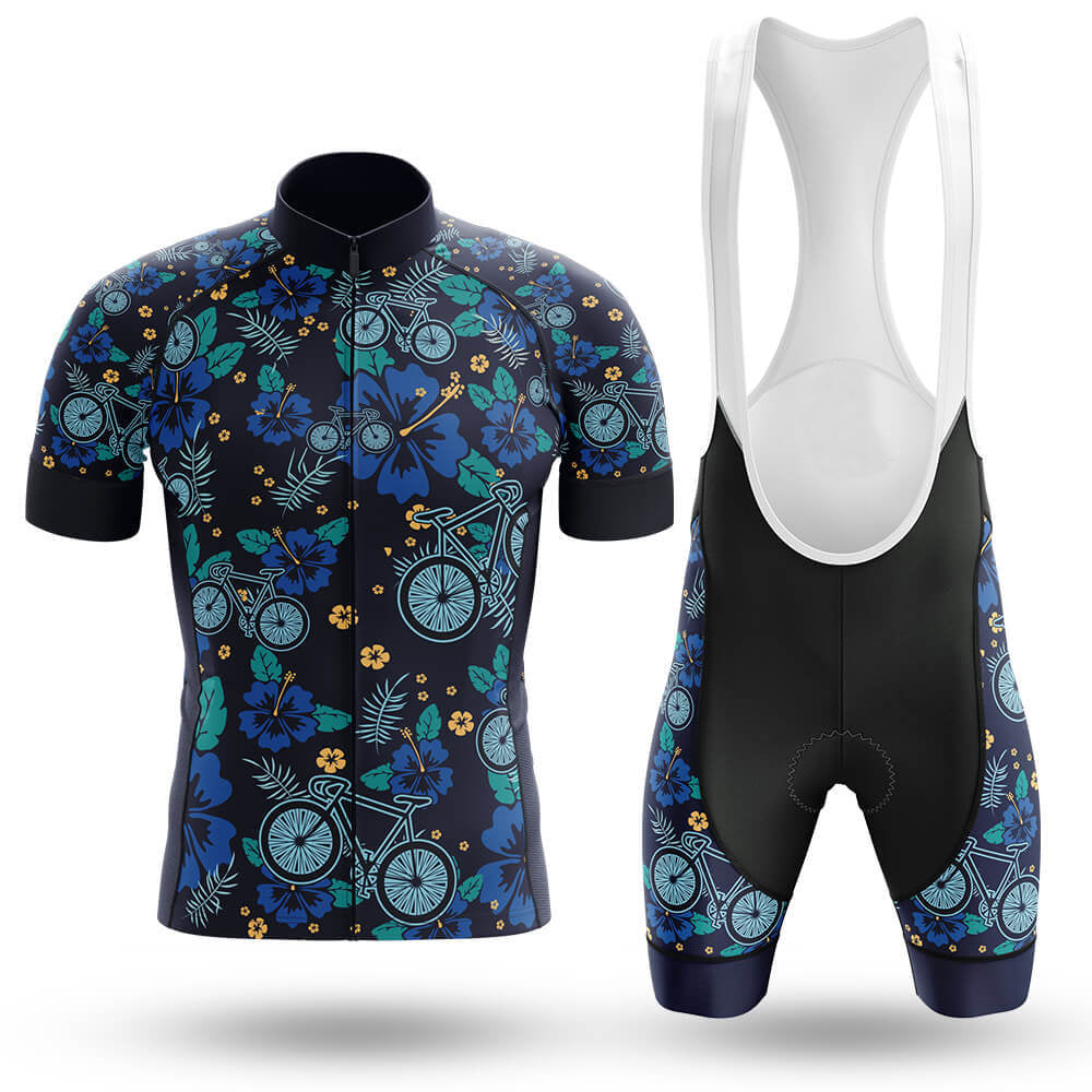 The Floral Bike Retro Cycling Jersey Set includes a dark blue short-sleeve jersey adorned with a vibrant bicycle and floral pattern in blue, green, and orange. The breathable black cycling shorts feature matching side panels for style and comfort.