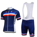 The French Team Cycling Jersey Set features a blue short-sleeved top with red, white, and blue stripes and FRANCE on the side. It includes matching bib shorts with a seat pad, white suspenders, and both pieces have a small French flag emblem.