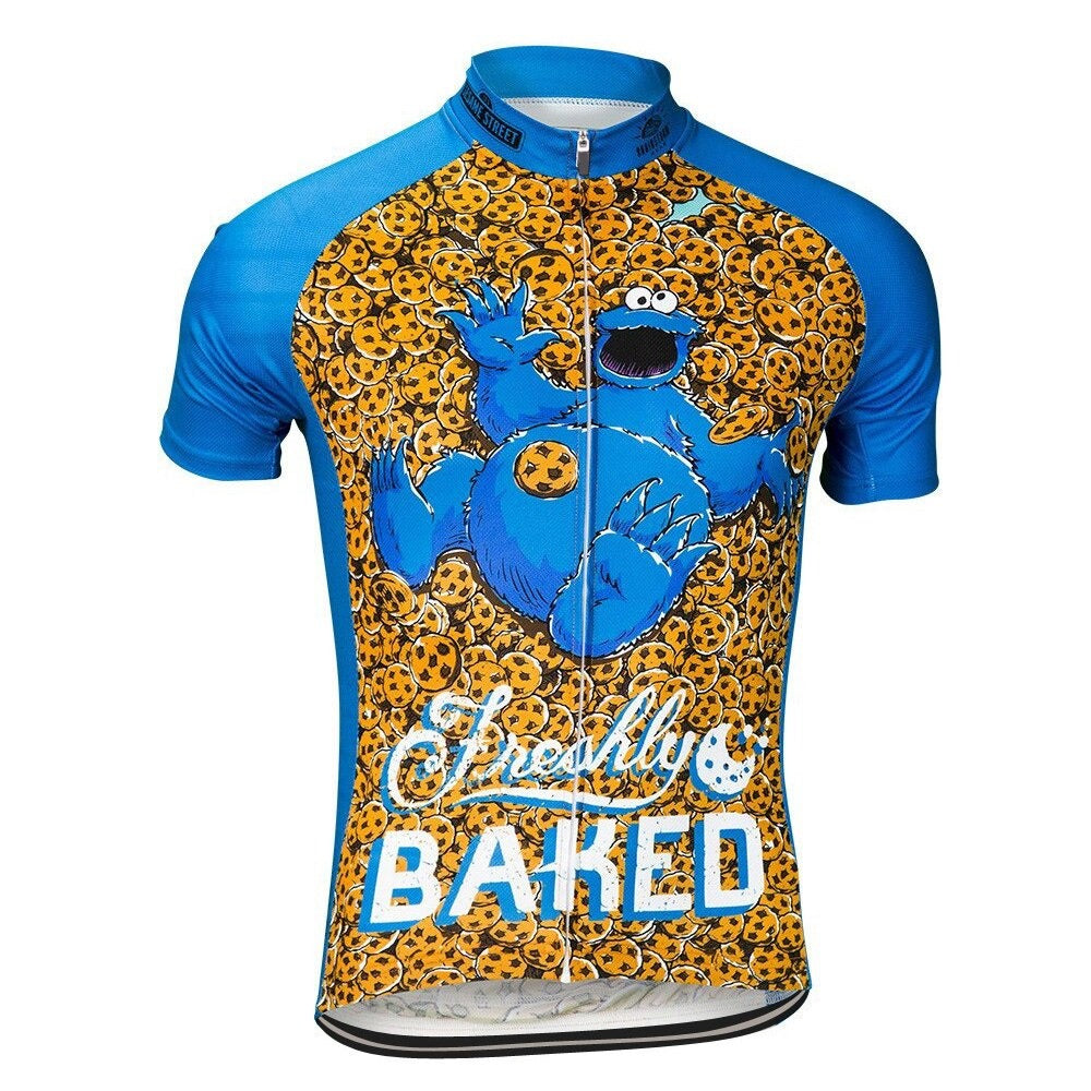 The Freshly Baked Cookie Monster Retro Cycling Jersey showcases a retro blue and orange design with a playful cartoon character amidst cookies and Freshly Baked text on the chest, echoing Cookie Monsters delightful chaos.