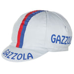 The Gazzola Retro Cycling Cap is light gray with a red and blue stripe from front to back, featuring GAZZOLA in blue on the side and brim for a classic retro look.