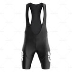 The GiS Trentino Vacanze Retro Cycling Jersey Set showcases black cycling bib shorts with a racerback design and padded seat. Made from breathable, comfortable, lightweight polyester for aerodynamic performance, it features white logo designs near the legs.