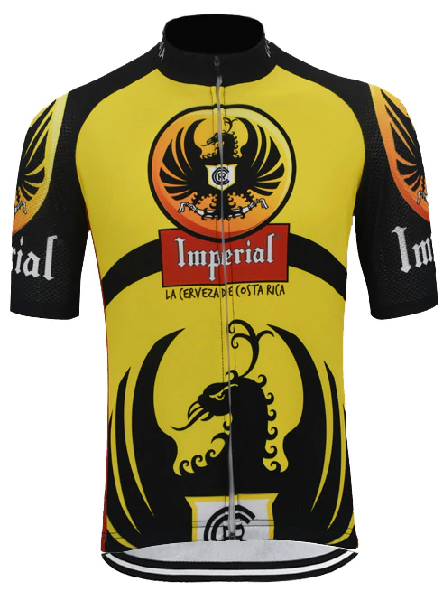 The Imperial Costa Rica Beer Cycling Jersey features a black and yellow design with an eagle emblem. Imperial is in bold red and white above La Cerveza de Costa Rica. Made from lightweight polyester, it has black sleeve and side accents celebrating Imperial Costa Rica Beer.