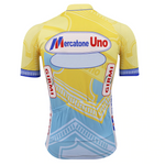The Mercatone Uno Retro Cycling Jersey Set features a vibrant yellow and light blue design with the Mercatone Uno logo, inspired by Marco Pantani. It showcases abstract patterns and logos such as Girmi, radiating nostalgic charm from every angle.