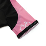 Close-up of the Bike Logo Pink Cycling Jersey Set sleeve with a pink and black design; features a white bicycle symbol on pink and a black gripper band at the hem.