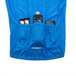 The Bike Logo Blue Cycling Jersey Set is ideal for cycling enthusiasts, featuring three rear pockets to hold two energy bars, a black and gray water bottle, and a black smartphone. Its part of our performance gear line for breathable comfort.