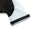A close-up of the Big Foot Sasquatch Cycling Jersey Set shows a short-sleeve, lightweight polyester jersey with black fabric on the left and light gray on the right, featuring black and white elastic sleeve bands with a side zipper detail. The smooth fabric is form-fitting.