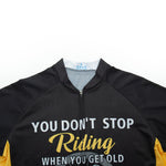 The Dont Stop Riding Cycling Jersey Set is a black and yellow polyester jersey with the text YOU DON’T STOP Riding WHEN YOU GET OLD on the front. Its comfortable, breathable, features a zippered front, and includes a small label near the neckline.